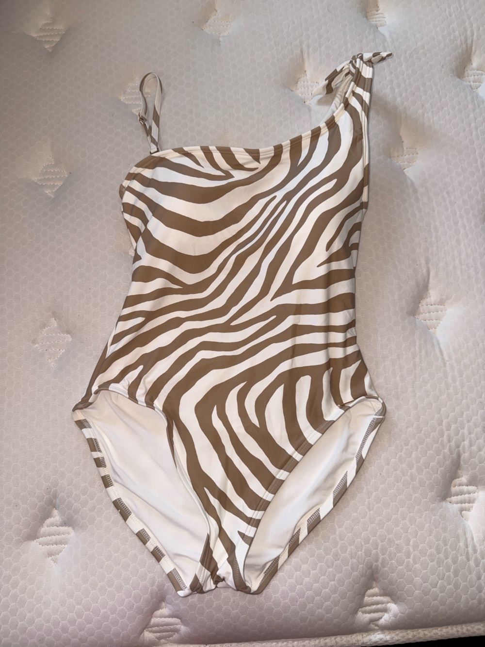 56. Michael Kors One-Shoulder Zebra Print One-Piece Swimsuit in White and Tan